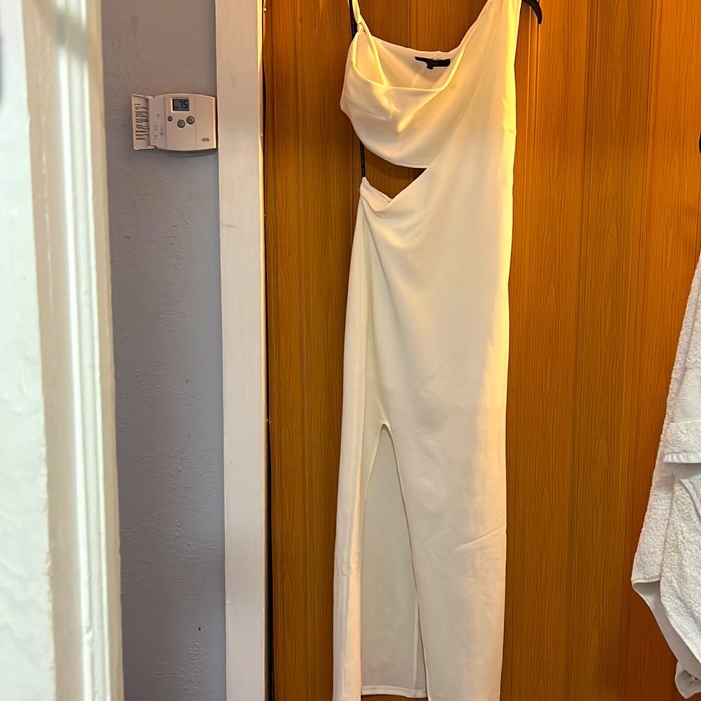 Long eggshell colored dress w/slit on side and front bottom just to big